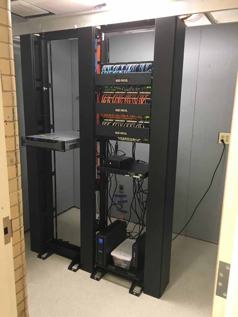 Bristol Preschool server closet with dual racks, colorful Neat-Patch cable management and UPS backup